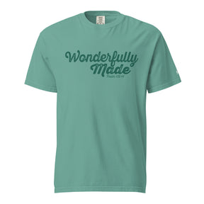 A mint green short-sleeve crewneck t-shirt with 'Wonderfully Made' printed in dark green script across the chest, displayed on a solid white background.