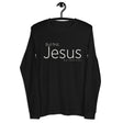 "But First, Jesus" "Matthew 6:33" printed in cream white ink on a black long sleeve shirt