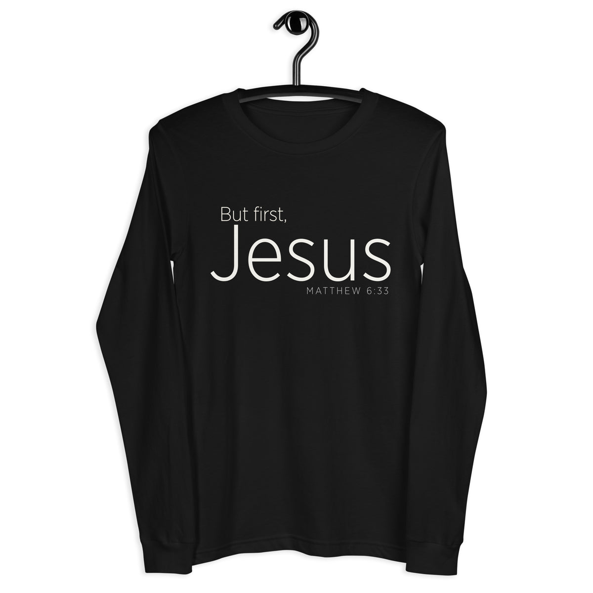 "But First, Jesus" "Matthew 6:33" printed in cream white ink on a black long sleeve shirt