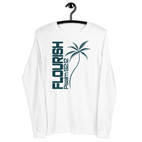 A white long-sleeve t-shirt hanging on a black hanger, featuring a dark teal graphic on the front with the text 'FLOURISH Psalm 182' and a palm tree illustration.