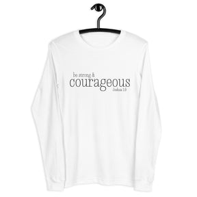 A white long-sleeve t-shirt hanging on a black hanger against a plain white background. The front of the shirt features the printed text 'be strong & courageous' from Joshua 1:9 in black lettering.