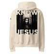 Beige hoodie with a graphic of Jesus in a forest and 'KNOW JESUS' text printed on the back of the hoodie in black ink.