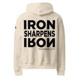 Beige hoodie with 'IRON SHARPENS IRON Proverbs 27:17' text on the back against a white background