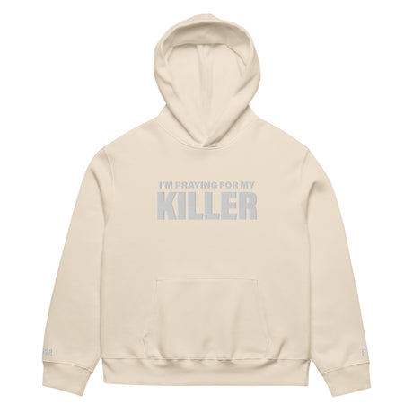 Beige hoodie with text 'I'm Praying for My Killer' on a white background