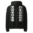 Black hoodie with white text printed on the back of the hoodie that says "The world called us broken, but Jesus calls us Chosen."