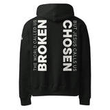 Black hoodie with white text printed on the back of the hoodie that says "The world called us broken, but Jesus calls us Chosen."