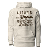 A light heather gray pullover hoodie with a dark brown graphic print on the front. The graphic features a cross, the text 'ALL I NEED IS Jesus AND A PUMPKIN SPICE Latte' in stylized fonts, and a small coffee cup illustration.