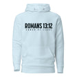 A light blue pullover hoodie with a black graphic print on the chest reading 'ROMANS 13:12' and 'ARMOR OF LIGHT'.