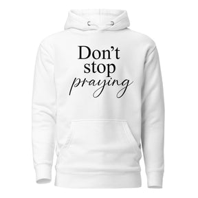 A white pullover hoodie with the text 'Don't stop praying' printed on the chest in black, shown against a plain white background.