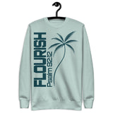 "Flourish Psalm 92:12" printed in dark teal ink on an agave colored sweatshirt, hanger view