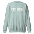 Agave blue unisex sweatshirt with cream-white “Peace, Be Still” lettering and Mark 4:39 printed beneath.
