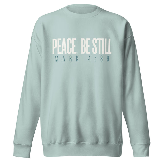Agave blue unisex sweatshirt with cream-white “Peace, Be Still” lettering and Mark 4:39 printed beneath.