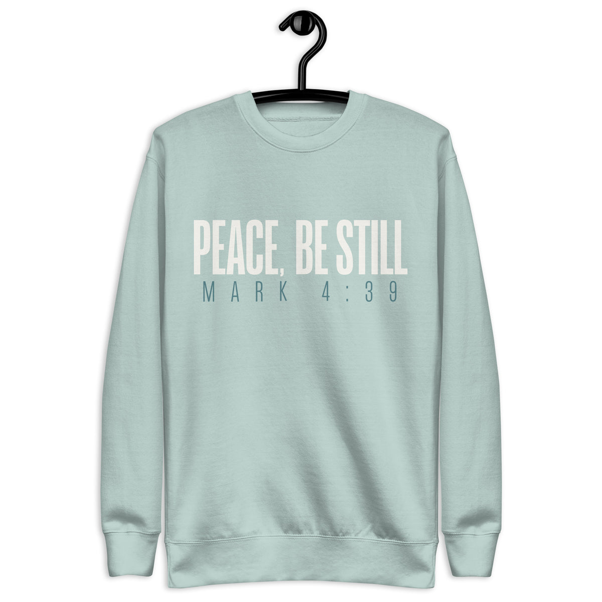 Agave blue unisex sweatshirt with cream-white “Peace, Be Still” lettering and Mark 4:39 printed beneath. Shown on hanger