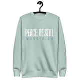 Agave blue unisex sweatshirt with cream-white “Peace, Be Still” lettering and Mark 4:39 printed beneath. Shown on hanger
