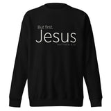 Black unisex sweatshirt with cream-white “But First, Jesus” typography and Matthew 6:33 printed on the front.