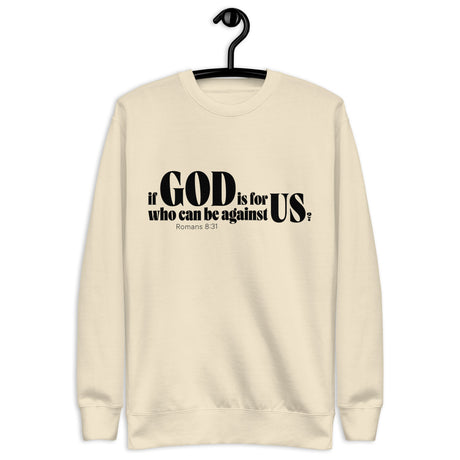 Bone-colored unisex sweatshirt with a black “If God Is for Us Who Can Be Against Us?” Romans 8:31 front design. Shown with hanger.