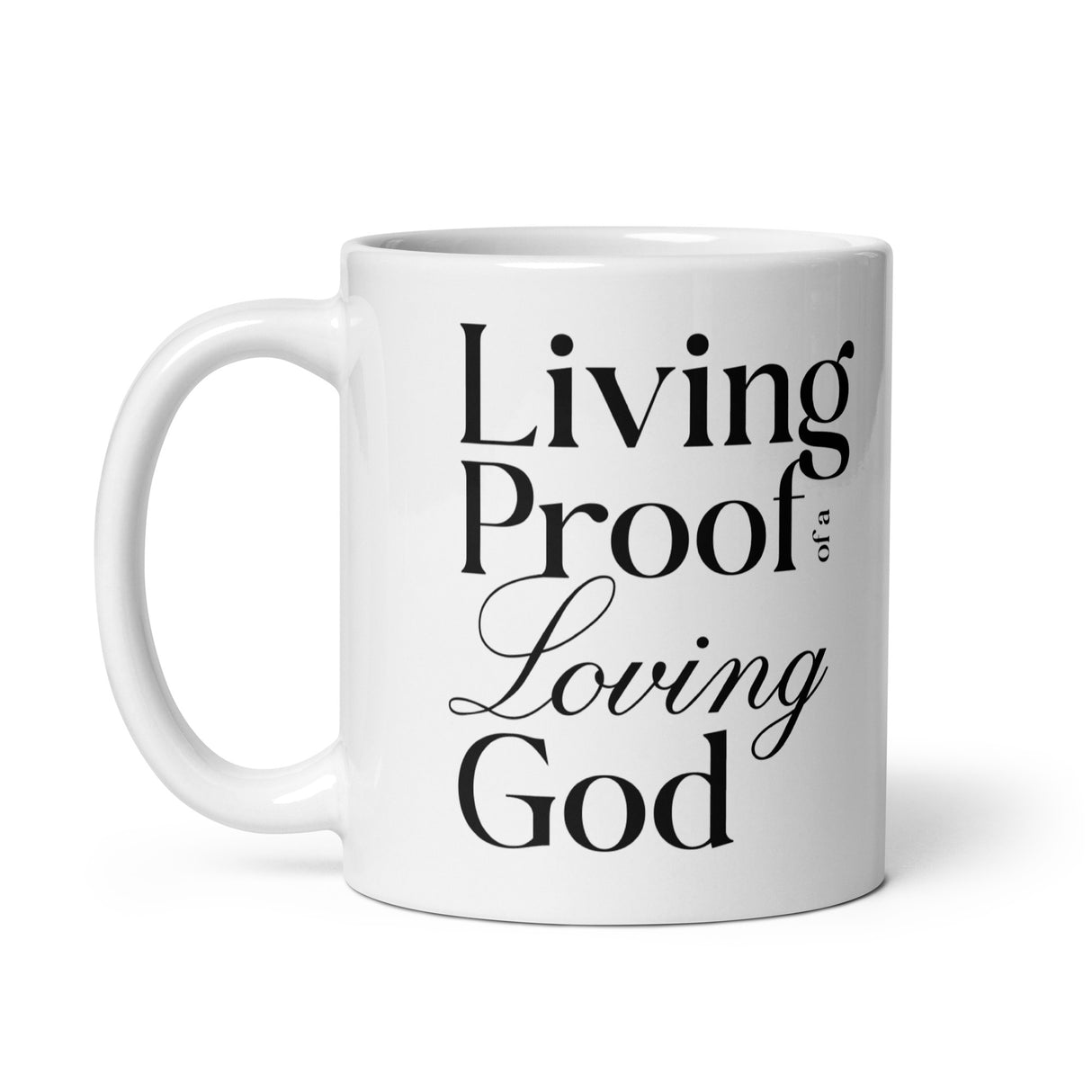 "Living Proof of a Loving God" printed in black lettering on a white glossy ceramic coffee mug