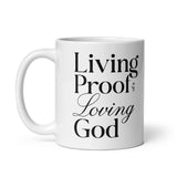 "Living Proof of a Loving God" printed in black lettering on a white glossy ceramic coffee mug