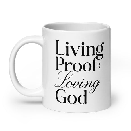 "Living Proof of a Loving God" printed in black lettering on a white glossy ceramic coffee mug