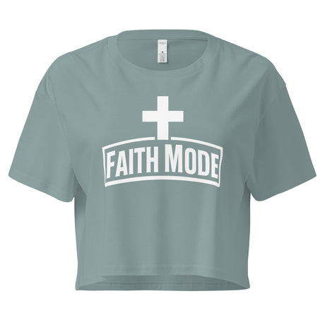 Teal crop top with 'Faith Mode' print on a white background