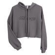 Front view of a Storm gray women’s crop hoodie with black “Be Strong and Courageous” Joshua 1:9 lettering, a drawstring hood, and long sleeves.