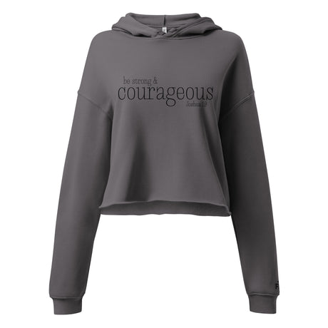 Front view of a Storm gray women’s crop hoodie with black “Be Strong and Courageous” Joshua 1:9 lettering, a drawstring hood, and long sleeves.