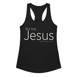 Black women’s racerback tank top featuring cream-white “But First, Jesus” typography and Matthew 6:33 on the front.