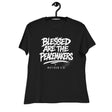 Black t-shirt with 'Blessed are the Peacemakers' text on a hanger