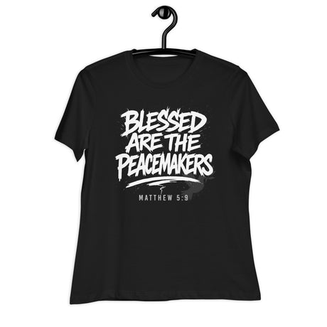 Black t-shirt with 'Blessed are the Peacemakers' text on a hanger