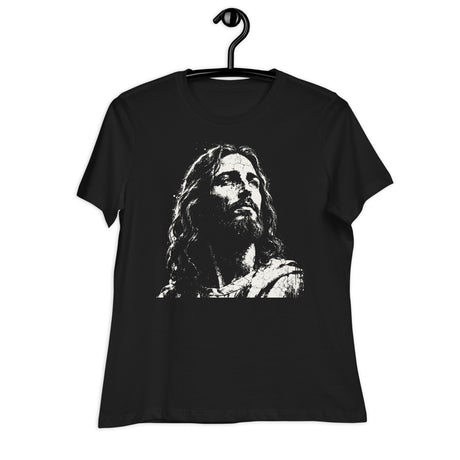 Black women’s crewneck T-shirt featuring a large distressed cream-colored portrait of Jesus looking upward, displayed on a black hanger against a white background.