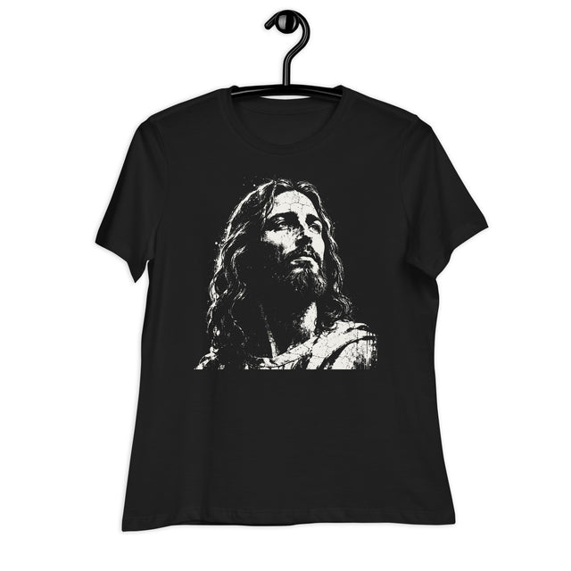 Black women’s crewneck T-shirt featuring a large distressed cream-colored portrait of Jesus looking upward, displayed on a black hanger against a white background.