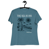 "The Sea is His" "Psalm 95:5" Printed in Cream white with a lightly distressed vintage 70s beach design in dark teal against a lighter teal women's shirt