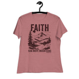 A heathered dusty rose short-sleeve t-shirt hanging on a black hanger against a plain white background. The shirt features a dark brown graphic print on the front with the word 'FAITH' above a mountain, lake, and pine tree landscape, with the text 'CAN MOVE MOUNTAINS' below.