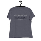 Cream white font that says "God Is With You" and under blue line designer style water accents "Isaiah 43:2" on a heather navy blue women's shirt
