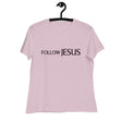 "Follow Jesus" in deep purple sans seif font across the chest of a light violet women's shirt