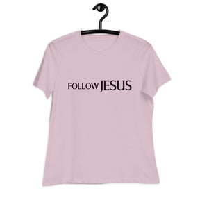 "Follow Jesus" in deep purple sans seif font across the chest of a light violet women's shirt
