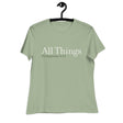 "All Things" printed in cream white ink with the scripture "Philippians 4:13" printed in dark green on a sage women's t-shirt. 