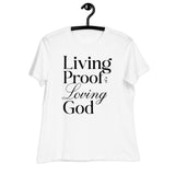 White t-shirt with 'Living Proof of a Loving God' text on a hanger against a white background